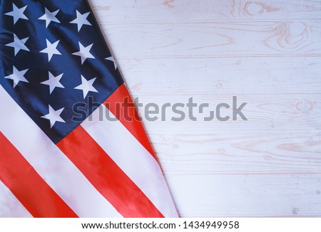 Flag of United States of America on white wooden background. 4th of july, independence concept.jpg
