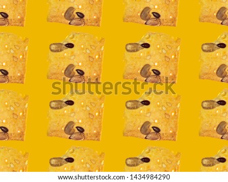 Seamless background from pieces of cookies on bright color yellow