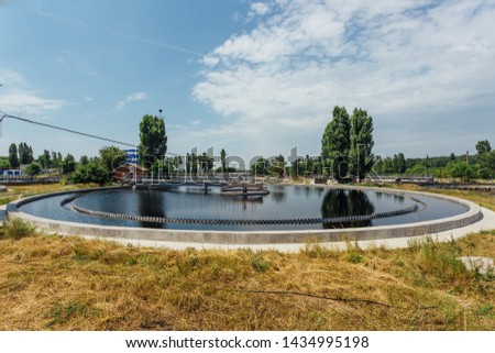 Modern sewage treatment plant. Sedimentation drainage round form.