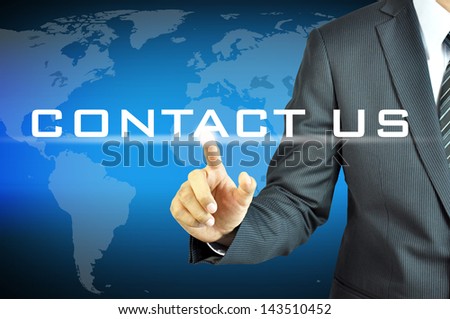 Business man pointing Contact Us sign