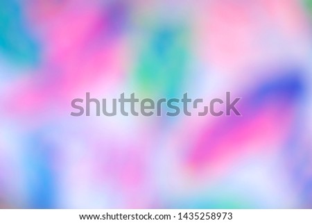 Holographic blurred abstract background. Iridescent gradient bright and vibrant texture. Rainbow, pearlescent modern decorative backdrop. Soft pink, blue and purple colors pastel futuristic wallpaper