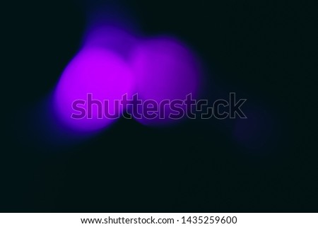 Magenta bokeh lights background. Bright blur abstract backdrop. Defocused shining, glowing effect. Pink overlay spots texture. Isolated blurry lighting, round shape flare on black image