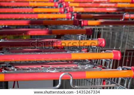 Supermarket trolleys stacked in lines