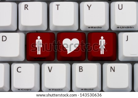 Computer keyboard keys with symbols of man and woman and a heart, Internet Dating Royalty-Free Stock Photo #143530636