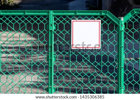 Closeup View Green Mobile Plastic Fence With Sign For Mockup