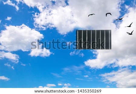 Free your mind concept and think out of the box concept, Bright blue sky day with clounds and security window bar on the sky with birds flying