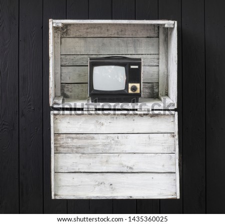 vintage TV with picture tube on white wooden