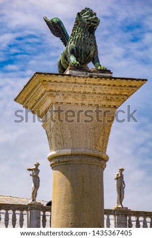 View at sculpture depicting image of lion with wings, symbol of Venice, on the top of the column at San Marco, Italy