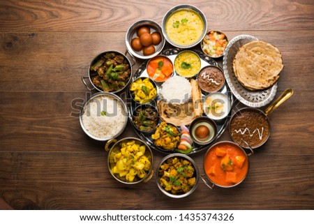Indian Hindu Veg Thali / food platter, selective focus Royalty-Free Stock Photo #1435374326