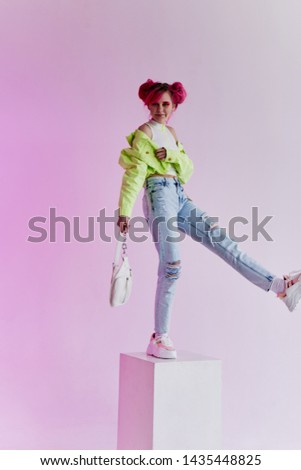 woman with pink hair stands in a cube fashion style