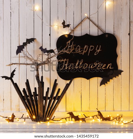 Halloween decorations on wooden background in home