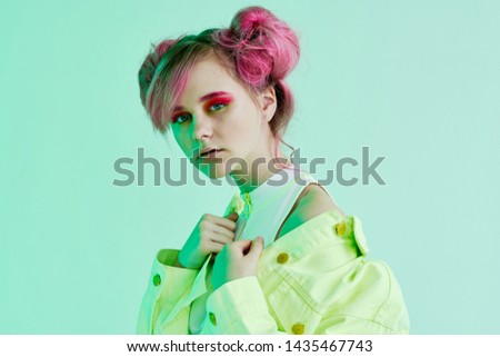 woman with pink hair with bright neon makeup
