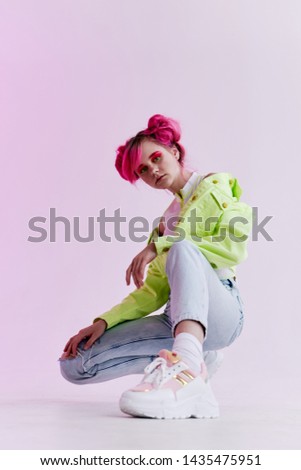 woman with pink hair in the studio