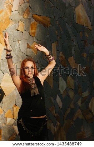 young woman dancing tribal ethnic