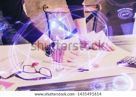 Man's hands working with notes background. Modern computer record diagram with virtual mnitor.
