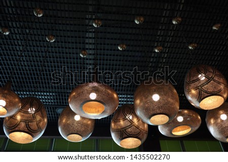 Interior with lamps of the restaurant. Near this restaurant living building. 