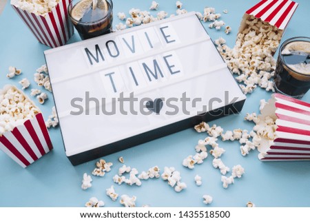 Popcorn box with a cinema sign