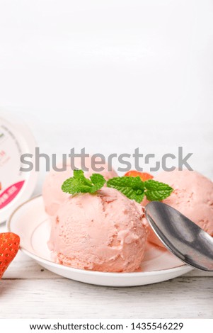 Strawberry ice cream balls on the table