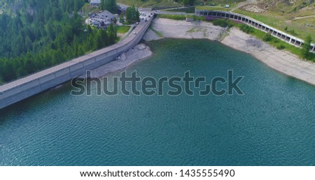 Lago Fedaia (Fedaia lake), an artificial lake and a dam near Canazei, located at the foot of Marmolada massif, as seen from Viel del Pan refuge, Dolomites, Trentino, province of Belluno, Italy