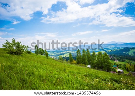 Green hillside in the village Royalty-Free Stock Photo #1435574456