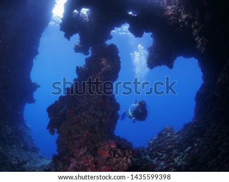 cave diving underwater scuba divers exploring caves
