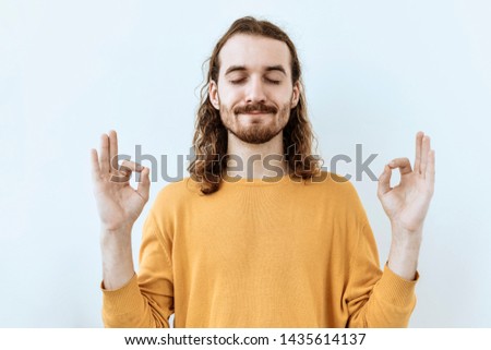 Keep balance. Calm and rest Bearded man portrait against white background