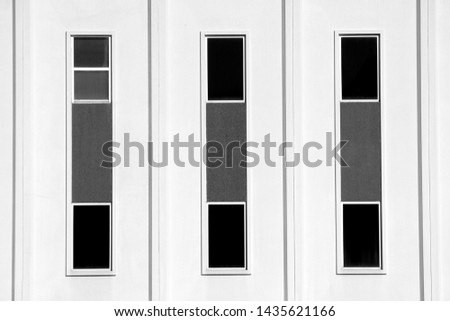 Black Geometric Windows on White Building