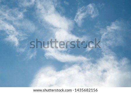 Bright sky and fluffy white clouds