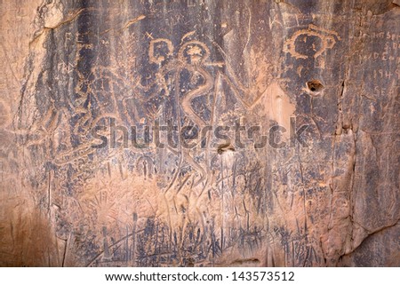 Ancient petroglyphs on a rock formation in South Dakota Royalty-Free Stock Photo #143573512
