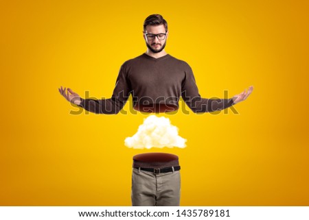 Young man in casual clothes cut in half with white cloud inside on yellow background. Digital art. People and objects. Casual outfit.