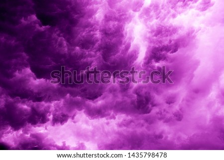 Background texture of dark storm clouds of the sky before a thunderstorm in rainy weather. Dramatic purple clouds.