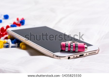 concept of mobile phone safety,smartphone with lock padlock on a white background. 