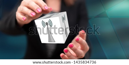 Wifi signal concept between hands of a woman in background
