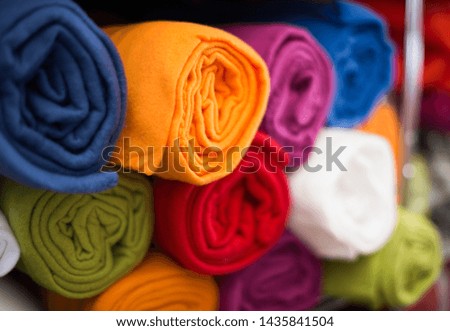 colour towel for bathroom in the textile store on the shelf