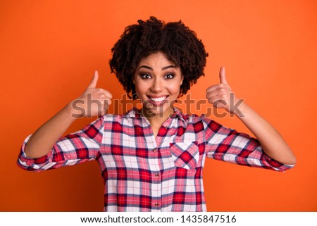 Portrait of nice cheerful cute adorable people person have advertisements advise choose decide adverts promo promotion wear checked shirt outfit modern isolated orange background
