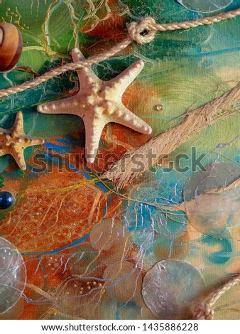 
Handicraft on the marine theme. shells, starfish, rope with knots on the sea background