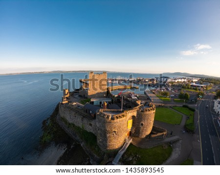 Carrickfergus Castle and Marina on Background Aerial view. Coastal Route in Northern Ireland 