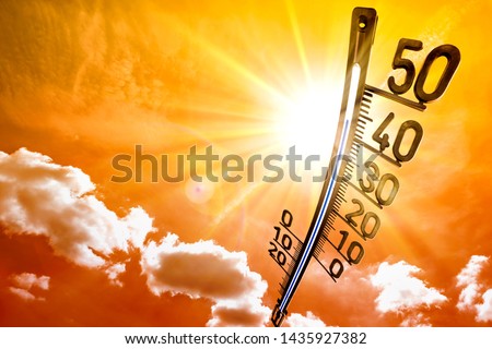 Hot summer or heat wave background, glowing sun on orange sky with thermometer Royalty-Free Stock Photo #1435927382