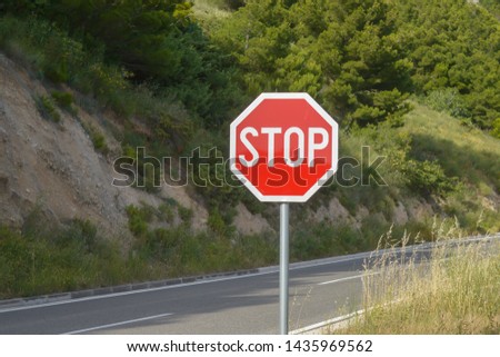 Stop sign on Adriatic Sea coast road. Makarska riviera of Dalmatia, Croatia