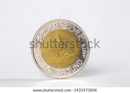 1 pound egyptian coin front isolated on white background Royalty-Free Stock Photo #1435973006