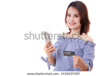 Portrait Beautiful of happy young woman with smartphone and black credit card on bright gray background for making payment