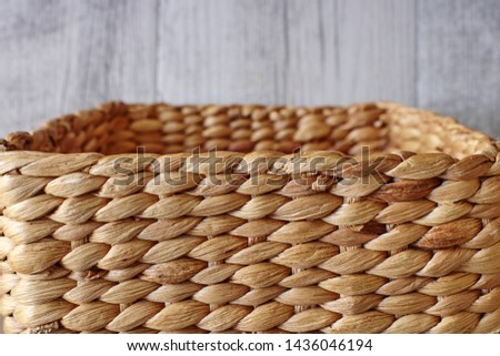 A studio photo of a wicker basket