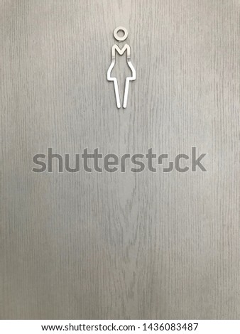 Bathroom sign on wooden floor, Toilet