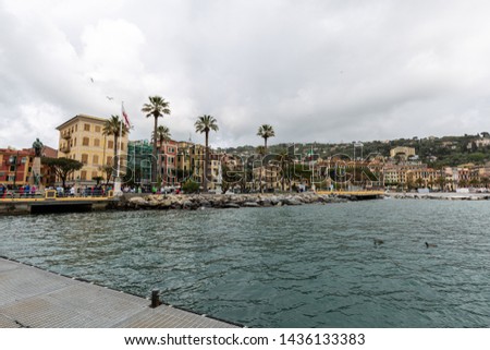 The shore of Santa Margherita Ligure with buildings, clouds and dramatic sky