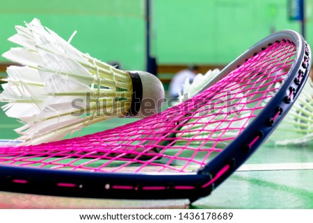 Badminton racket Break on floor court.sports concept,Badminton ball and racket ,badminton background,selective focus, 