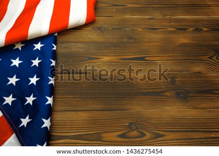 American flag on a old wooden desk top view - Image 