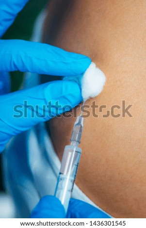 Medical Professional Administering a Flu Vaccine Injection