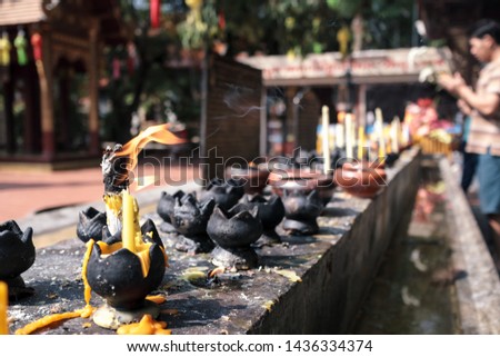 burning candles in buddhist temple