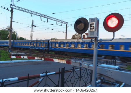 Train traffic jam at railroad cross on blurred train background