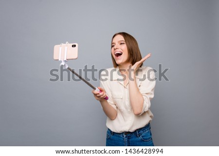 Close up photo amazing beautiful she her lady hold hands arms metal telephone stick overjoyed crazy funky funny speak tell skype foreign friends wear casual white shirt isolated grey background